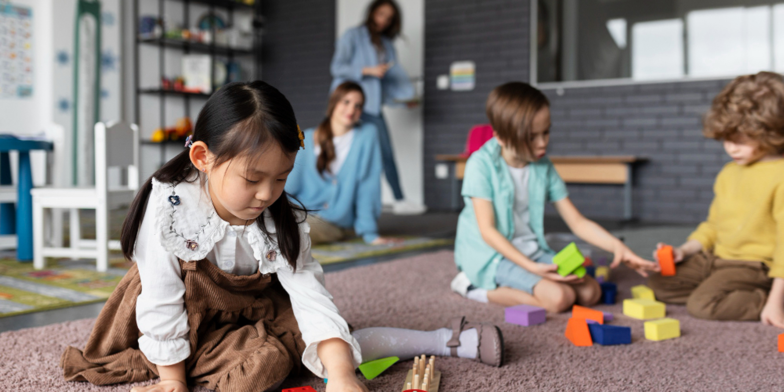 Professional cleaner disinfecting play area surfaces at a Melbourne childcare centre